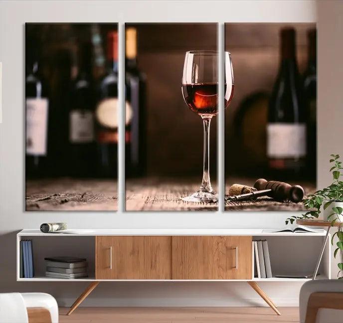 The "Red Wine and Bottle Canvas Print" is a triptych on museum-quality canvas, featuring a glass of red wine with subtle depictions of wine bottles and corks in the background, all beautifully gallery wrapped.