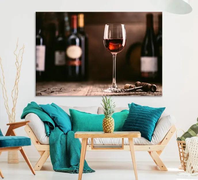 The "Red Wine and Bottle Canvas Print" is a triptych on museum-quality canvas, featuring a glass of red wine with subtle depictions of wine bottles and corks in the background, all beautifully gallery wrapped.