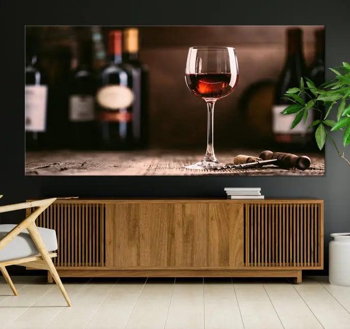 The "Red Wine and Bottle Canvas Print" is a triptych on museum-quality canvas, featuring a glass of red wine with subtle depictions of wine bottles and corks in the background, all beautifully gallery wrapped.