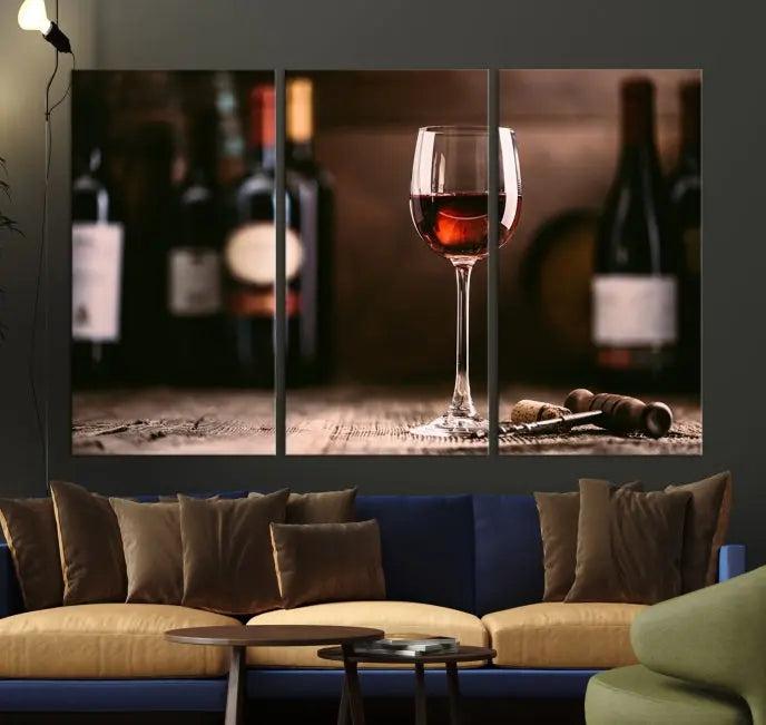 The "Red Wine and Bottle Canvas Print" is a triptych on museum-quality canvas, featuring a glass of red wine with subtle depictions of wine bottles and corks in the background, all beautifully gallery wrapped.