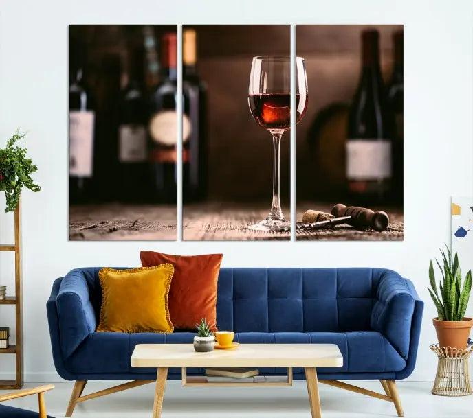 The "Red Wine and Bottle Canvas Print" is a triptych on museum-quality canvas, featuring a glass of red wine with subtle depictions of wine bottles and corks in the background, all beautifully gallery wrapped.