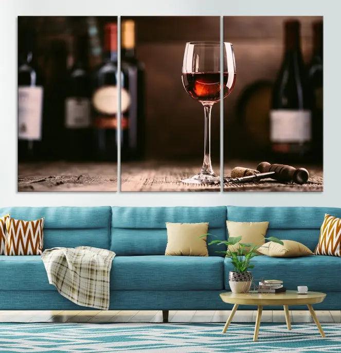 The "Red Wine and Bottle Canvas Print" is a triptych on museum-quality canvas, featuring a glass of red wine with subtle depictions of wine bottles and corks in the background, all beautifully gallery wrapped.