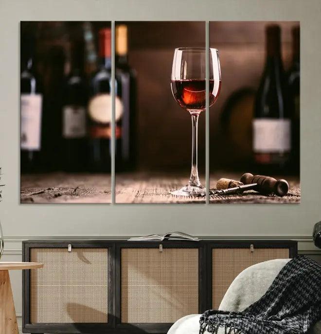 The "Red Wine and Bottle Canvas Print" is a triptych on museum-quality canvas, featuring a glass of red wine with subtle depictions of wine bottles and corks in the background, all beautifully gallery wrapped.