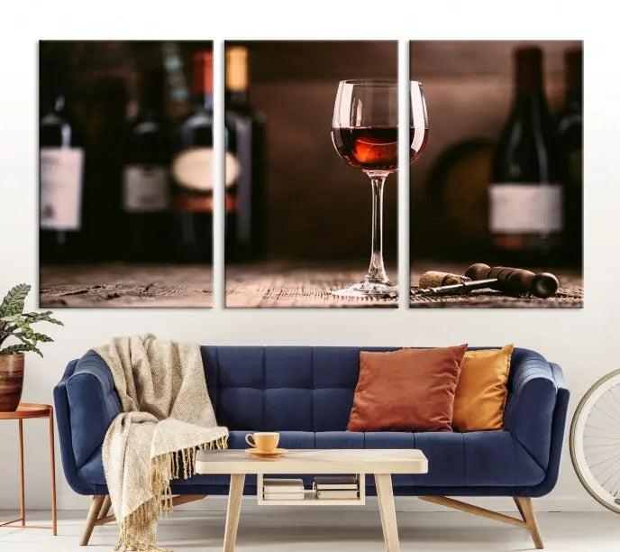 The "Red Wine and Bottle Canvas Print" is a triptych on museum-quality canvas, featuring a glass of red wine with subtle depictions of wine bottles and corks in the background, all beautifully gallery wrapped.