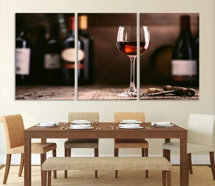 The "Red Wine and Bottle Canvas Print" is a triptych on museum-quality canvas, featuring a glass of red wine with subtle depictions of wine bottles and corks in the background, all beautifully gallery wrapped.