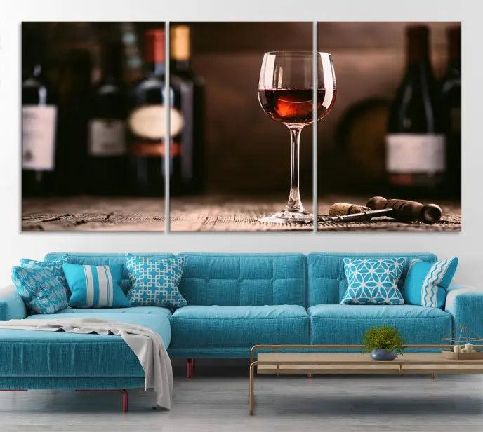 The "Red Wine and Bottle Canvas Print" is a triptych on museum-quality canvas, featuring a glass of red wine with subtle depictions of wine bottles and corks in the background, all beautifully gallery wrapped.