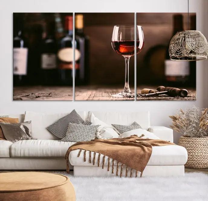 The "Red Wine and Bottle Canvas Print" is a triptych on museum-quality canvas, featuring a glass of red wine with subtle depictions of wine bottles and corks in the background, all beautifully gallery wrapped.