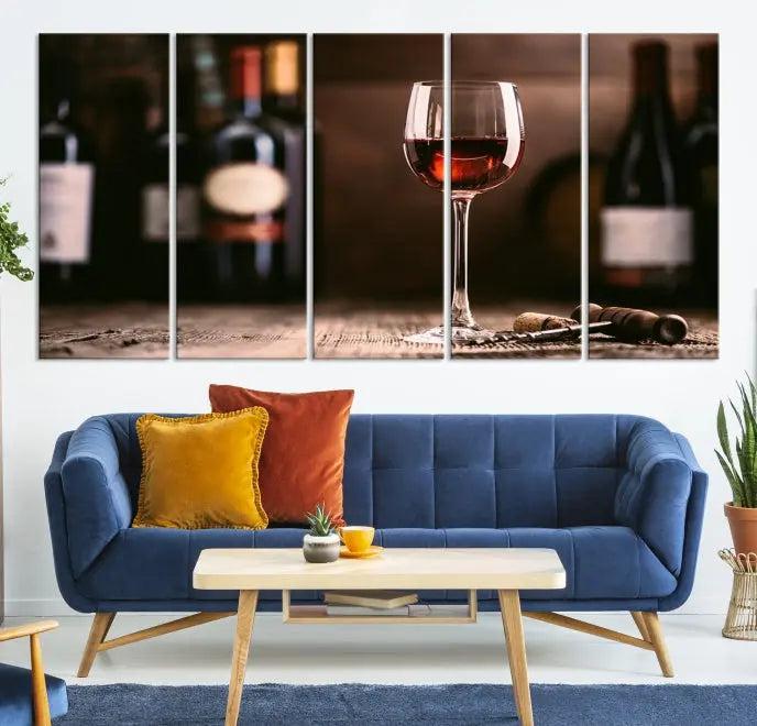 The "Red Wine and Bottle Canvas Print" is a triptych on museum-quality canvas, featuring a glass of red wine with subtle depictions of wine bottles and corks in the background, all beautifully gallery wrapped.