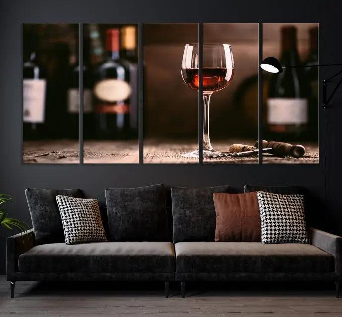 The "Red Wine and Bottle Canvas Print" is a triptych on museum-quality canvas, featuring a glass of red wine with subtle depictions of wine bottles and corks in the background, all beautifully gallery wrapped.