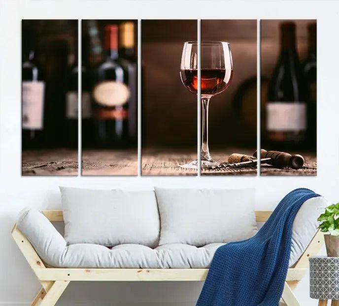 The "Red Wine and Bottle Canvas Print" is a triptych on museum-quality canvas, featuring a glass of red wine with subtle depictions of wine bottles and corks in the background, all beautifully gallery wrapped.