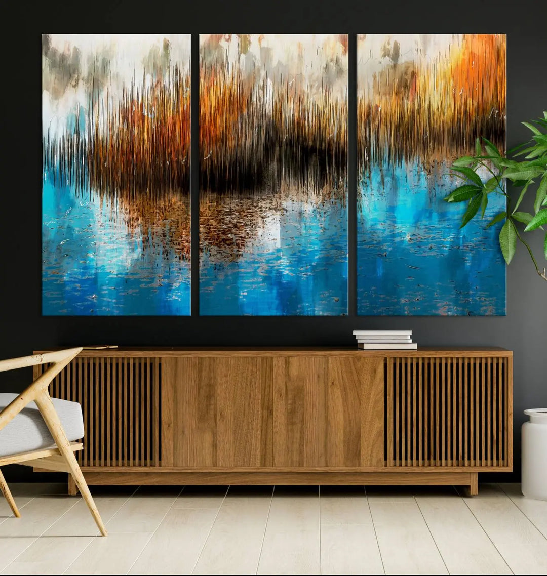 The "Restful Landscape Art Abstract Lake Canvas Print Wall Art" showcases a spectrum of vibrant blue, orange, and brown hues on museum-quality canvas. It comes with UV-protective coating and is ready to hang.