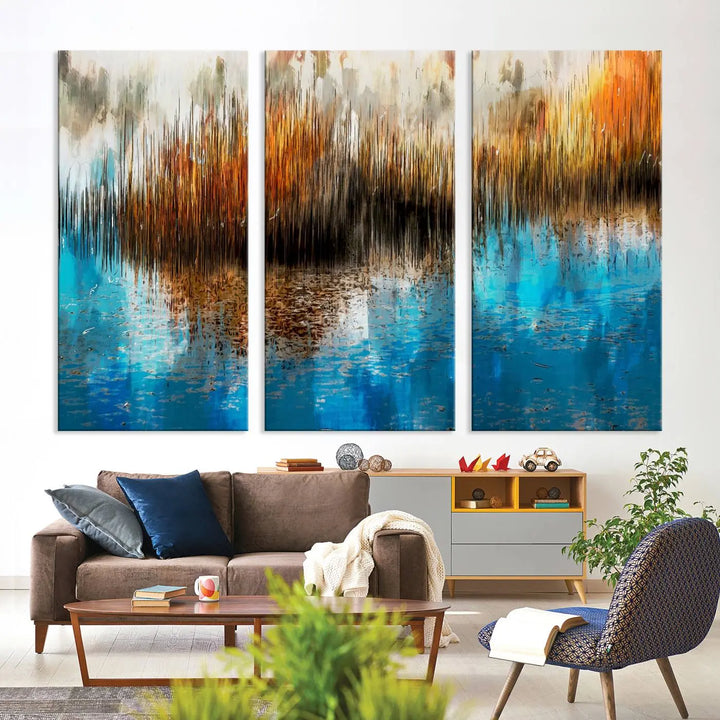 The "Restful Landscape Art Abstract Lake Canvas Print Wall Art" showcases a spectrum of vibrant blue, orange, and brown hues on museum-quality canvas. It comes with UV-protective coating and is ready to hang.