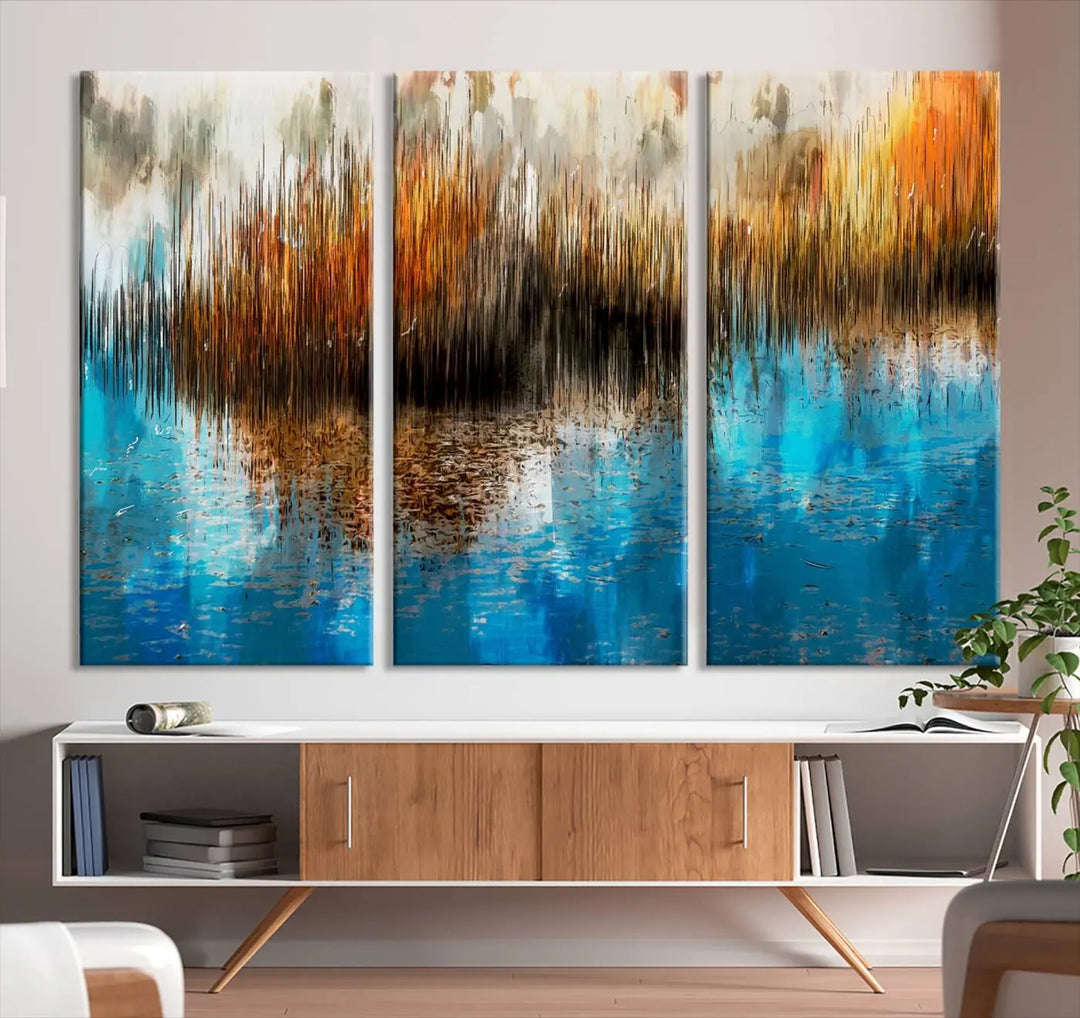 The "Restful Landscape Art Abstract Lake Canvas Print Wall Art" showcases a spectrum of vibrant blue, orange, and brown hues on museum-quality canvas. It comes with UV-protective coating and is ready to hang.