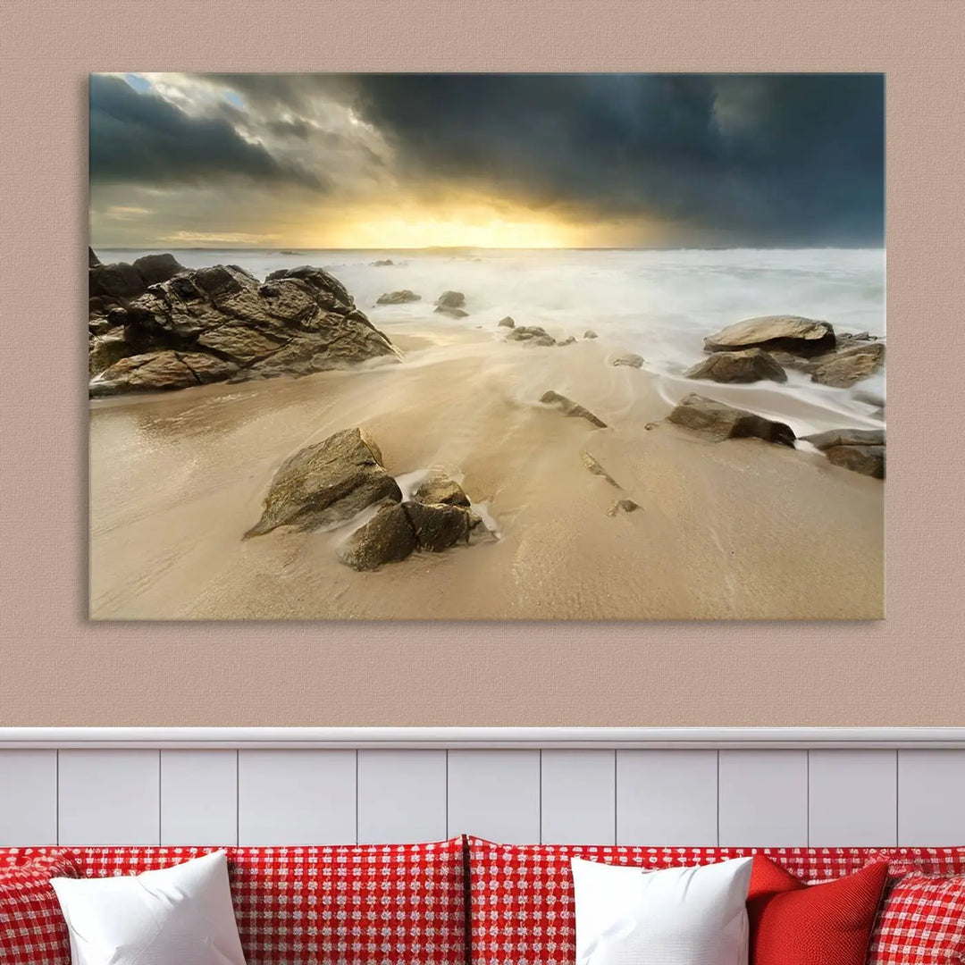 A gallery-wrapped, three-panel artwork titled "Rocks and Waves Wall Art Canvas Print" depicts a rocky beach at sunset. Each canvas showcases museum-quality craftsmanship and a UV-protective coating to maintain its vibrant colors.