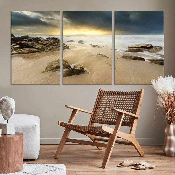 A gallery-wrapped, three-panel artwork titled "Rocks and Waves Wall Art Canvas Print" depicts a rocky beach at sunset. Each canvas showcases museum-quality craftsmanship and a UV-protective coating to maintain its vibrant colors.