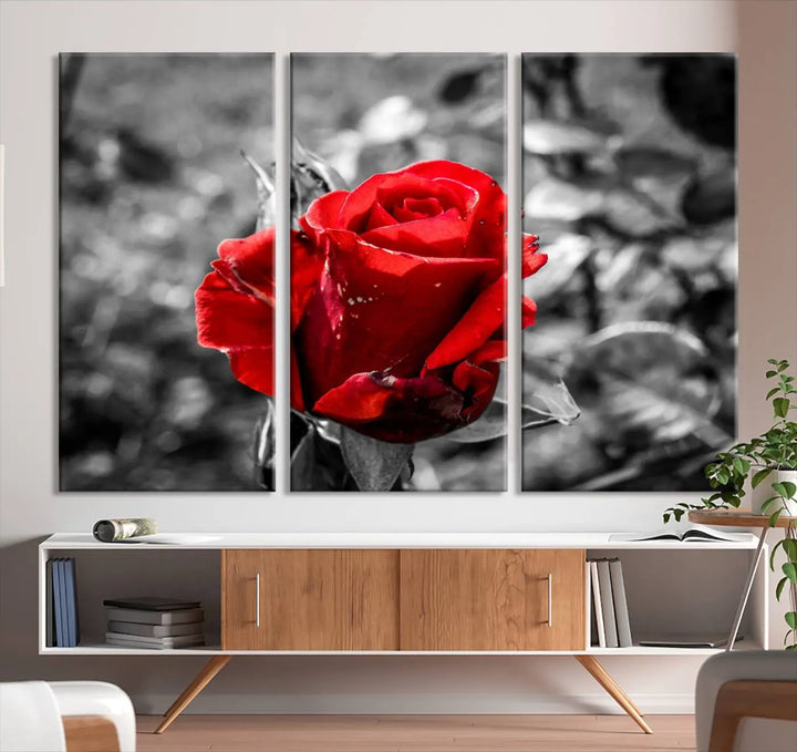 The living room boasts the exquisite Rose Canvas Wall Art—a three-panel masterpiece showcasing a red rose against a black and white background. This artwork is created on museum-quality canvas and finished with a UV-protective coating, ensuring lasting vibrancy in every professionally crafted piece.