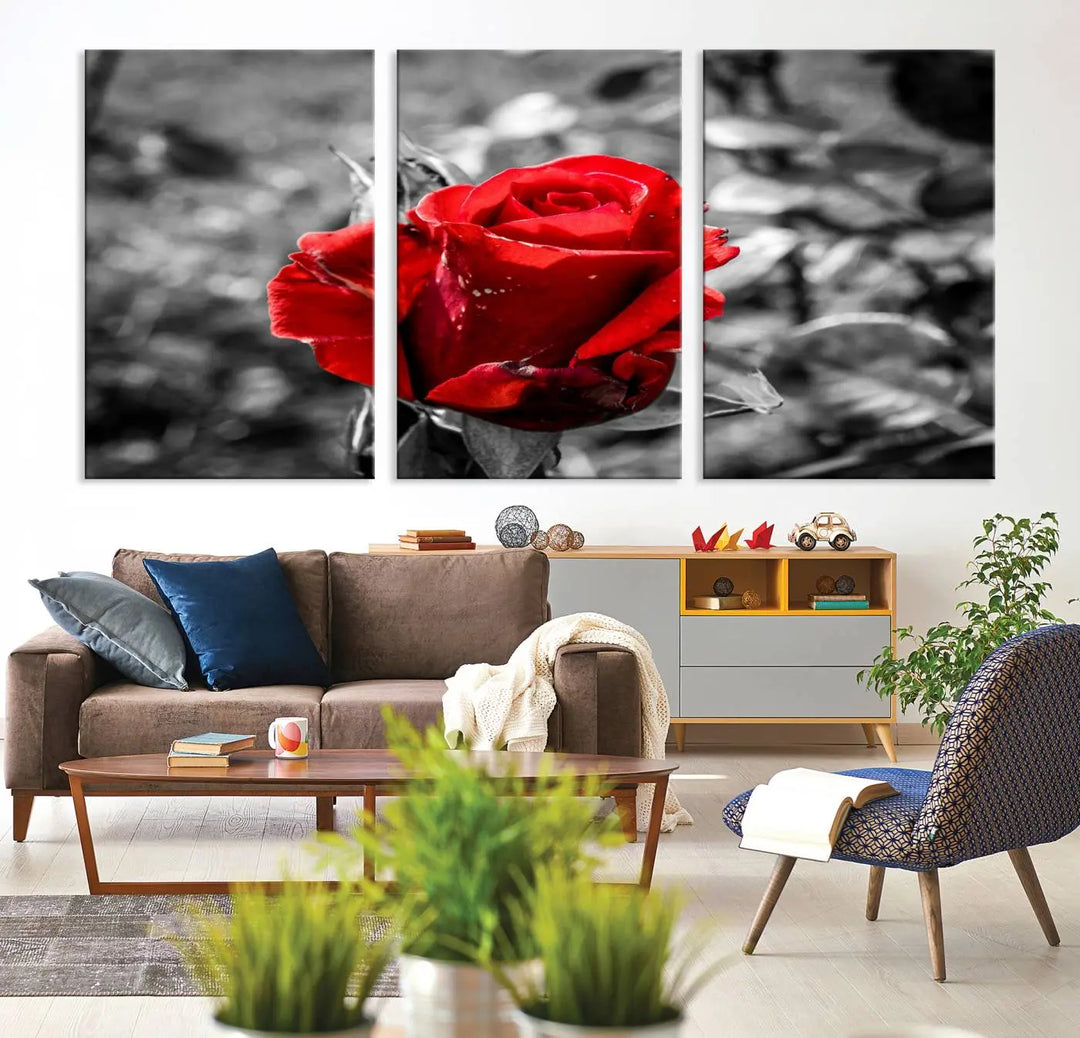 The living room boasts the exquisite Rose Canvas Wall Art—a three-panel masterpiece showcasing a red rose against a black and white background. This artwork is created on museum-quality canvas and finished with a UV-protective coating, ensuring lasting vibrancy in every professionally crafted piece.