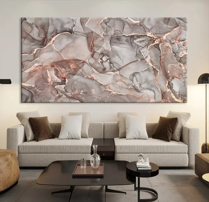 The Rose Gold Marble Fluid Effect Wall Art Abstract Canvas Wall Art Print is an exquisite three-panel creation crafted on museum-quality canvas. It features swirling marbled patterns in shades of gray, copper, and beige. Complete with a UV-protective coating, this ready-to-hang artwork promises to be a timeless addition to any space.