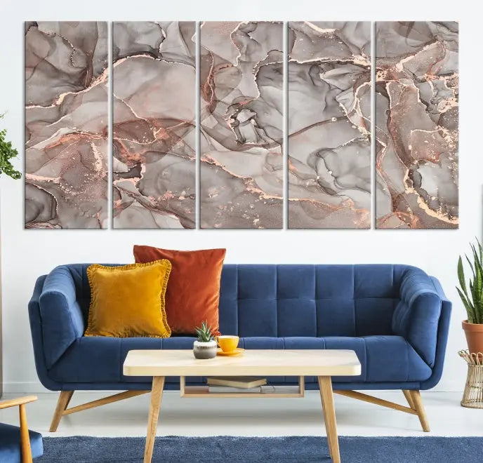 The Rose Gold Marble Fluid Effect Wall Art Abstract Canvas Wall Art Print is an exquisite three-panel creation crafted on museum-quality canvas. It features swirling marbled patterns in shades of gray, copper, and beige. Complete with a UV-protective coating, this ready-to-hang artwork promises to be a timeless addition to any space.