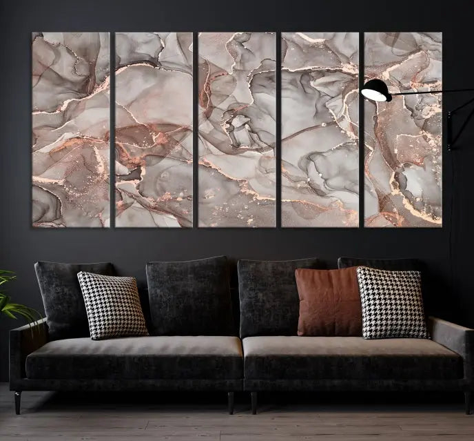 The Rose Gold Marble Fluid Effect Wall Art Abstract Canvas Wall Art Print is an exquisite three-panel creation crafted on museum-quality canvas. It features swirling marbled patterns in shades of gray, copper, and beige. Complete with a UV-protective coating, this ready-to-hang artwork promises to be a timeless addition to any space.