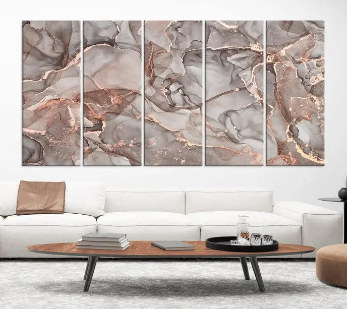 The Rose Gold Marble Fluid Effect Wall Art Abstract Canvas Wall Art Print is an exquisite three-panel creation crafted on museum-quality canvas. It features swirling marbled patterns in shades of gray, copper, and beige. Complete with a UV-protective coating, this ready-to-hang artwork promises to be a timeless addition to any space.