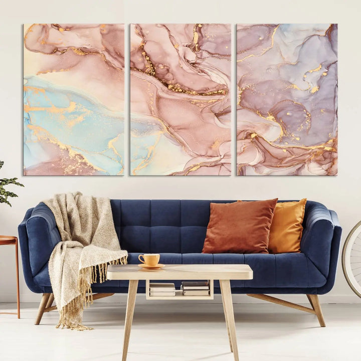 The Rose Gold Marble Fluid Effect Wall Art Abstract Canvas Wall Art Print features stunning pink, blue, and gold streaks to add elegance to your room. Enjoy the museum-quality canvas that resists fading thanks to its UV-protective coating, ensuring lasting beauty.