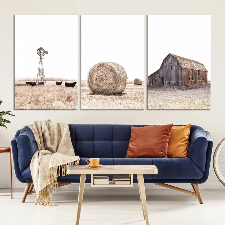 A captivating art set titled "Rustic Farmhouse Wall Art Set of 3 – Country Barn and Wheat Field" adorns the room. These farm prints, depicting a windmill, cattle, hay bale, and weathered barn by a serene wheat field, beautifully enhance the country home and gallery wall decor.