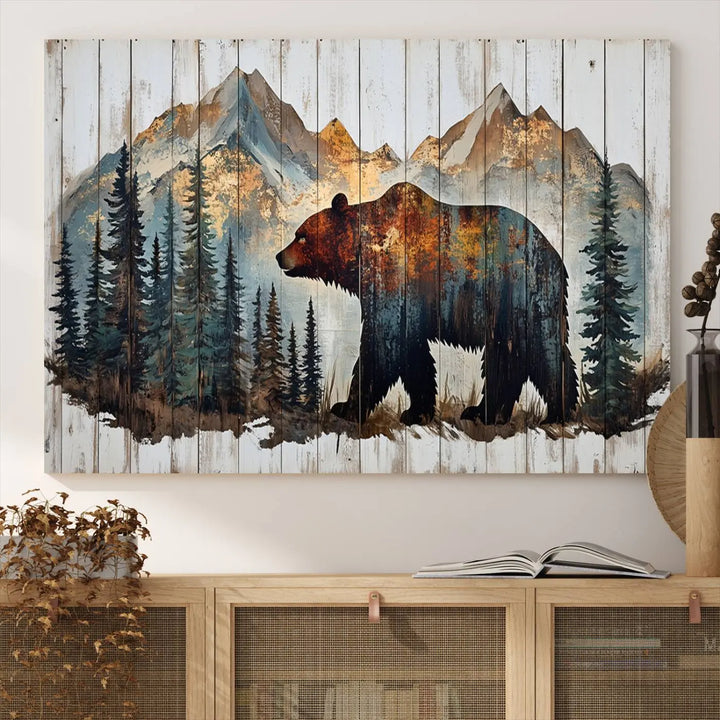 The Rustic Grizzly 399 Bear and Mountain Wood Canvas Wall Art elegantly depicts a majestic bear in a pine forest with mountain silhouettes, expertly framed on distressed wooden panels. This nature-inspired piece infuses charm and warmth, serving as perfect cabin wall decor.