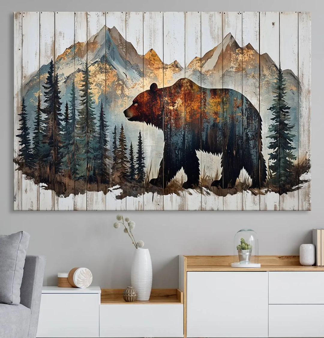 The Rustic Grizzly 399 Bear and Mountain Wood Canvas Wall Art elegantly depicts a majestic bear in a pine forest with mountain silhouettes, expertly framed on distressed wooden panels. This nature-inspired piece infuses charm and warmth, serving as perfect cabin wall decor.