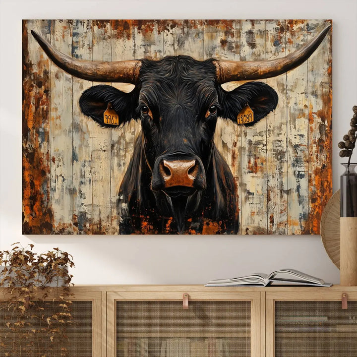 A triptych featuring the "Rustic Texas Artwork Wall Art Canvas Print" showcases an abstract depiction of a majestic longhorn bull with large horns on a textured background, adding a striking touch to the living room. Ideal for enthusiasts of Western home decor.