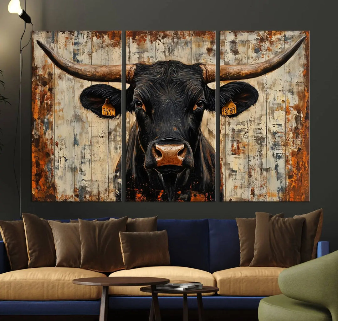 A triptych featuring the "Rustic Texas Artwork Wall Art Canvas Print" showcases an abstract depiction of a majestic longhorn bull with large horns on a textured background, adding a striking touch to the living room. Ideal for enthusiasts of Western home decor.