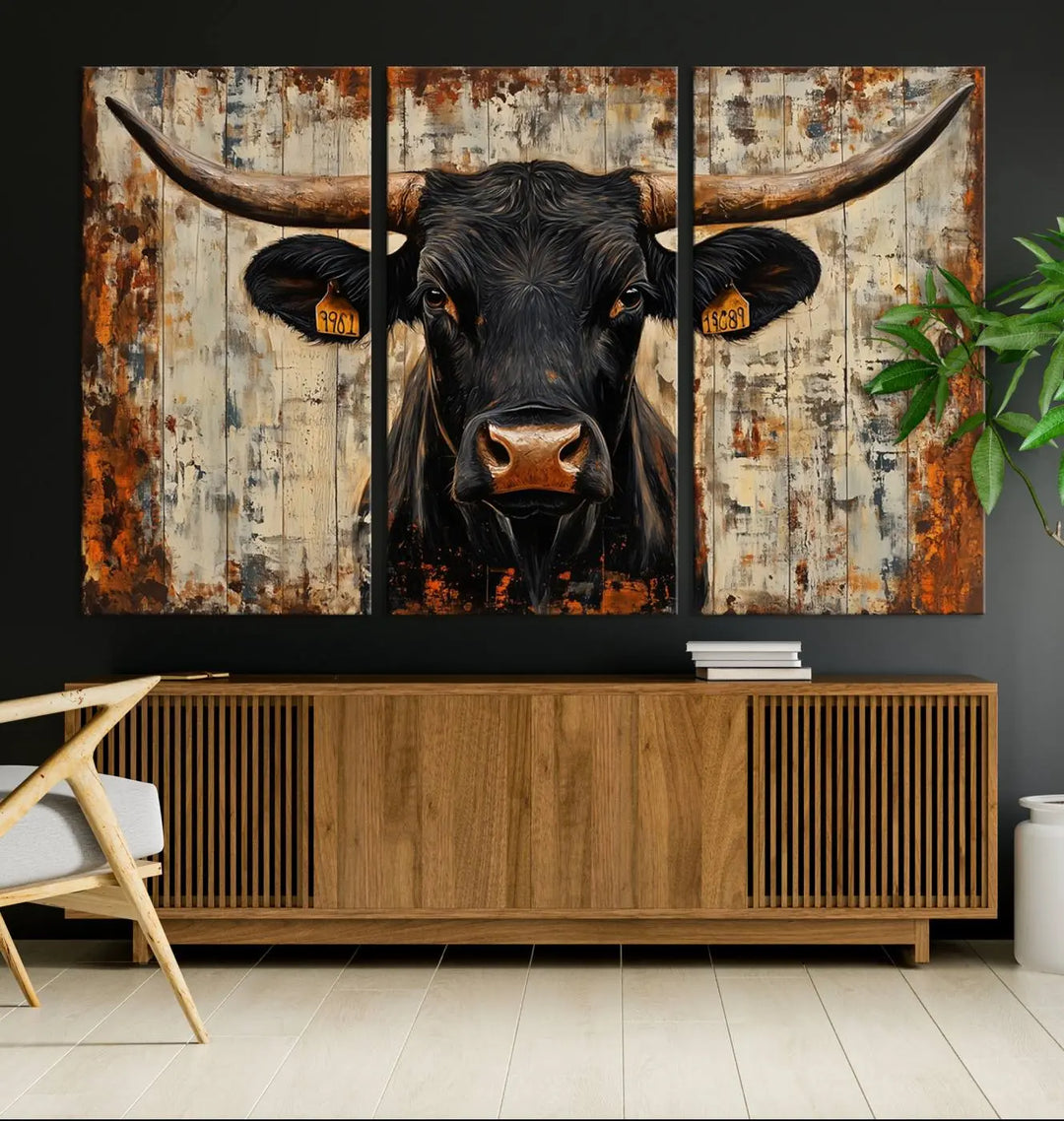 A triptych featuring the "Rustic Texas Artwork Wall Art Canvas Print" showcases an abstract depiction of a majestic longhorn bull with large horns on a textured background, adding a striking touch to the living room. Ideal for enthusiasts of Western home decor.