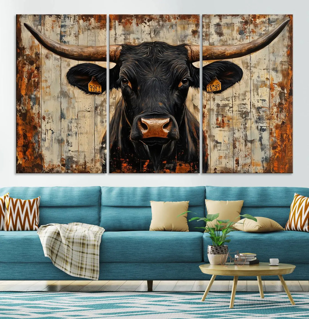 A triptych featuring the "Rustic Texas Artwork Wall Art Canvas Print" showcases an abstract depiction of a majestic longhorn bull with large horns on a textured background, adding a striking touch to the living room. Ideal for enthusiasts of Western home decor.