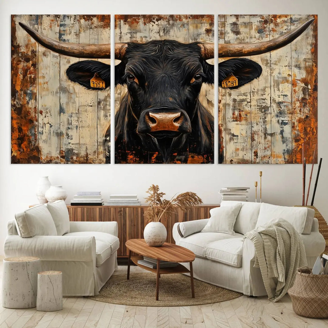 A triptych featuring the "Rustic Texas Artwork Wall Art Canvas Print" showcases an abstract depiction of a majestic longhorn bull with large horns on a textured background, adding a striking touch to the living room. Ideal for enthusiasts of Western home decor.