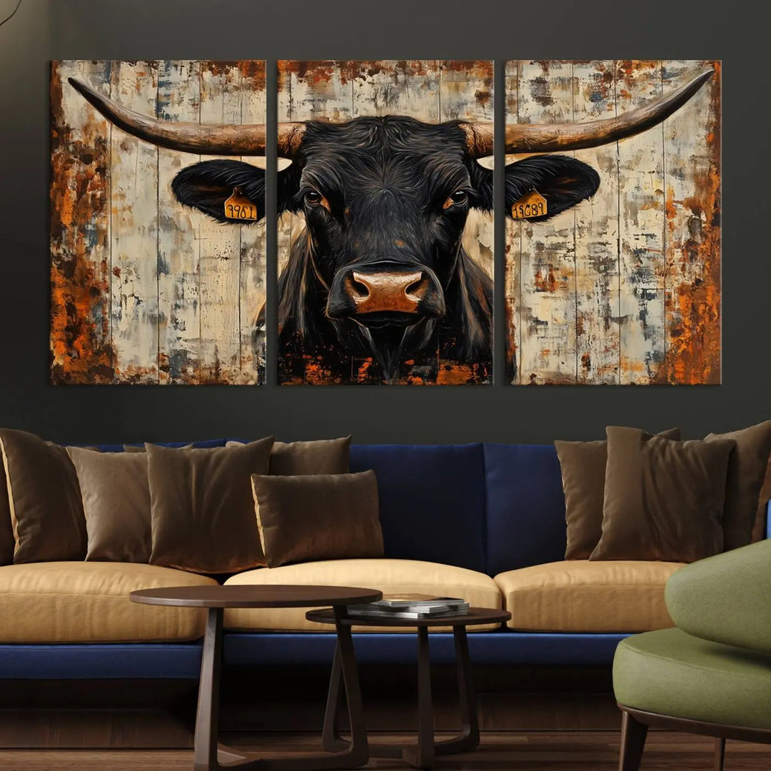 A triptych featuring the "Rustic Texas Artwork Wall Art Canvas Print" showcases an abstract depiction of a majestic longhorn bull with large horns on a textured background, adding a striking touch to the living room. Ideal for enthusiasts of Western home decor.