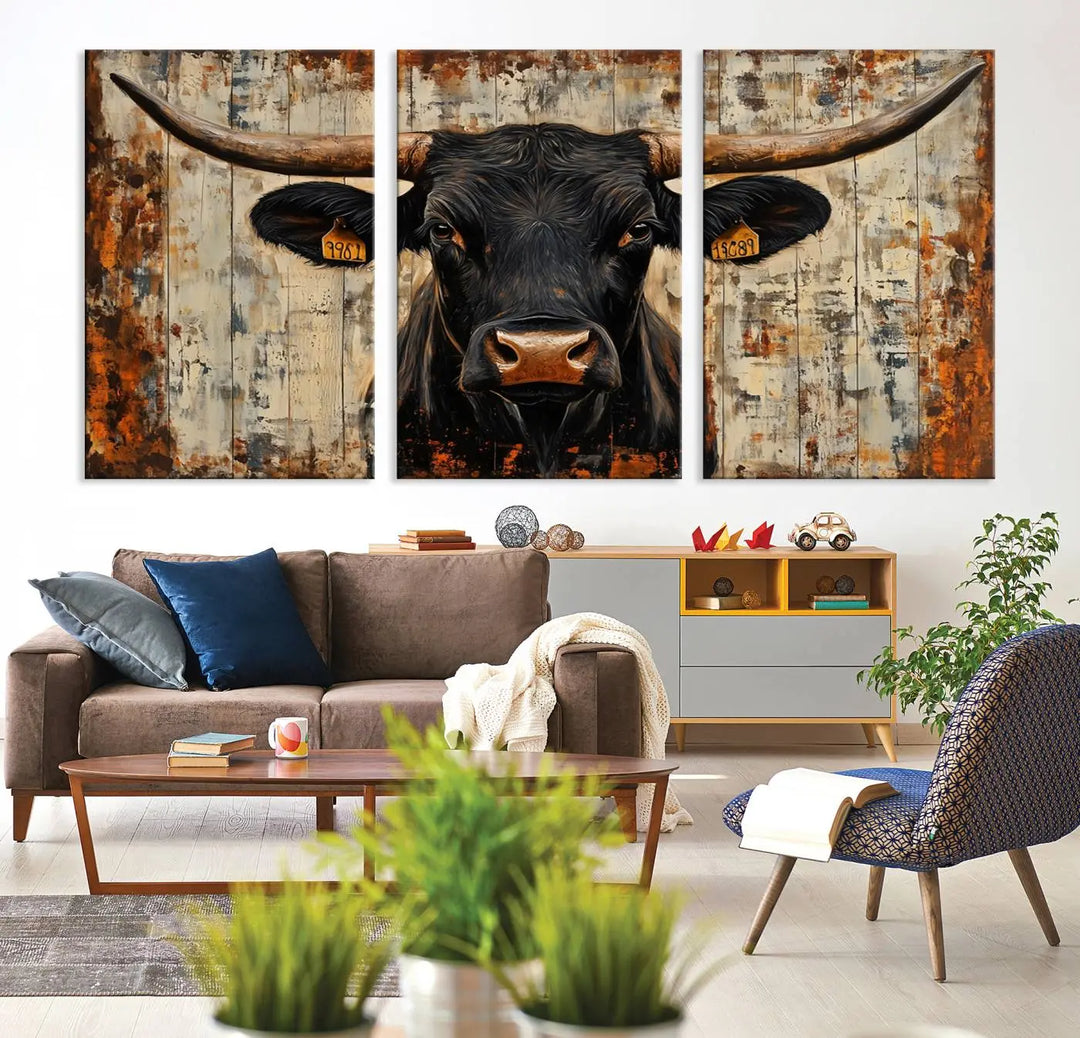 A triptych featuring the "Rustic Texas Artwork Wall Art Canvas Print" showcases an abstract depiction of a majestic longhorn bull with large horns on a textured background, adding a striking touch to the living room. Ideal for enthusiasts of Western home decor.