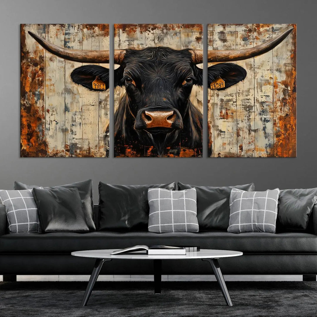 A triptych featuring the "Rustic Texas Artwork Wall Art Canvas Print" showcases an abstract depiction of a majestic longhorn bull with large horns on a textured background, adding a striking touch to the living room. Ideal for enthusiasts of Western home decor.