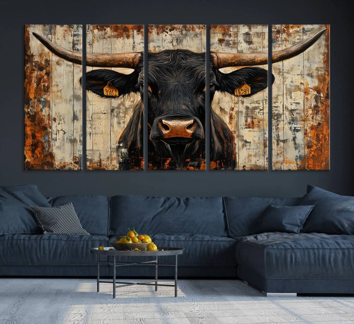 A triptych featuring the "Rustic Texas Artwork Wall Art Canvas Print" showcases an abstract depiction of a majestic longhorn bull with large horns on a textured background, adding a striking touch to the living room. Ideal for enthusiasts of Western home decor.