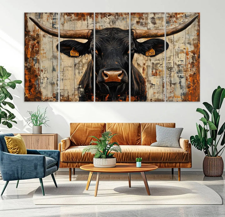 A triptych featuring the "Rustic Texas Artwork Wall Art Canvas Print" showcases an abstract depiction of a majestic longhorn bull with large horns on a textured background, adding a striking touch to the living room. Ideal for enthusiasts of Western home decor.