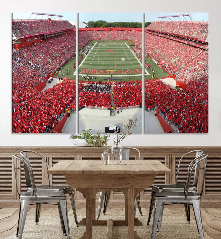 The room features a large wall art piece titled "Rutgers Scarlet Knights Football Team Print - Piscataway SHI Stadium Wall Art Canvas Print." This artwork showcases a vibrant, packed football stadium and boasts a gallery-quality finish on premium canvas, adding an elegant touch to the lively scene.