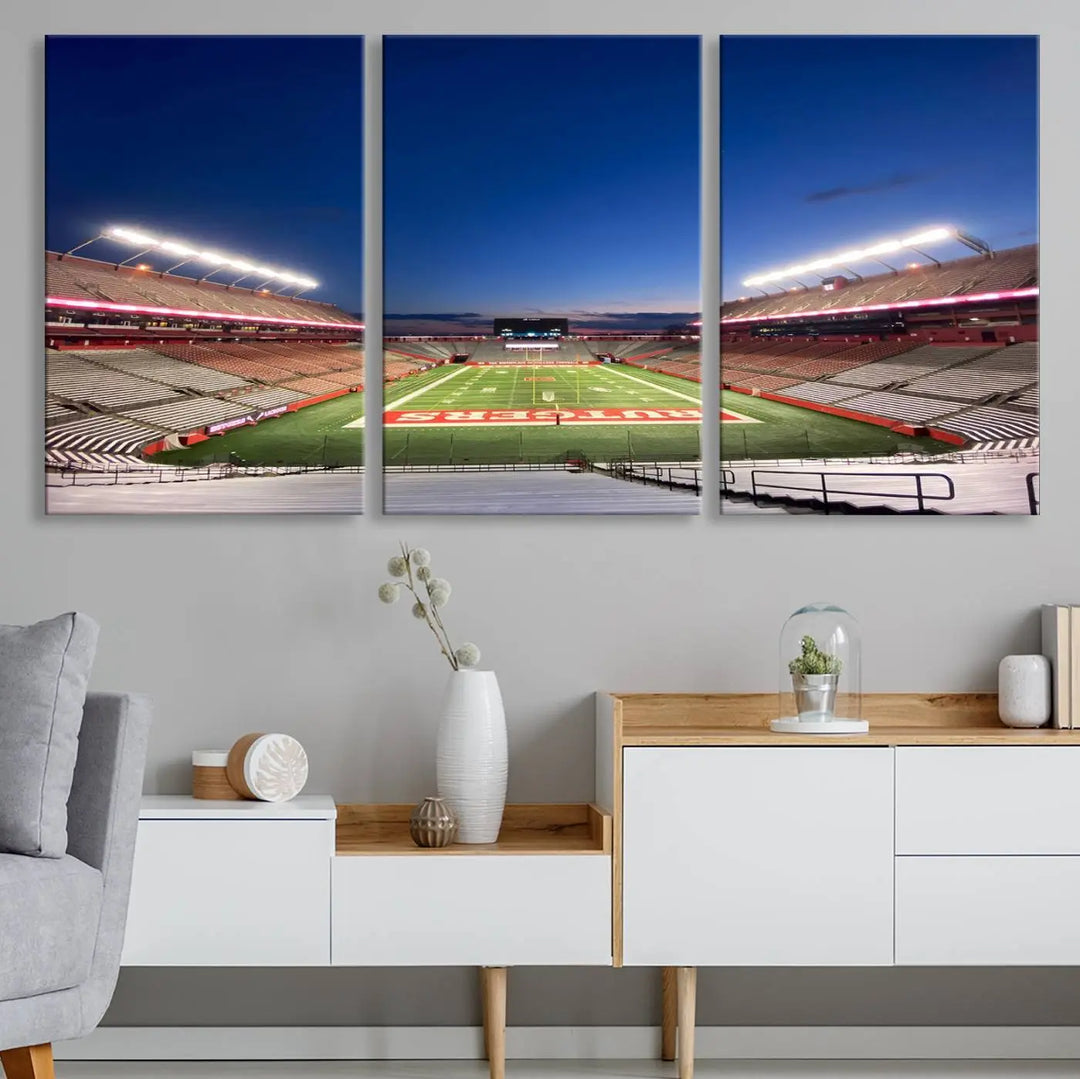 The dining area features a Rutgers Scarlet Knights Football Team Print, depicting the Piscataway SHI Stadium as panoramic wall art. Its premium canvas offers a gallery-quality finish.