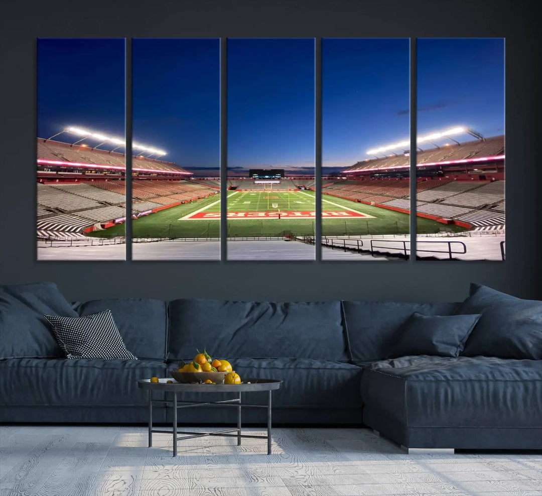 The dining area features a Rutgers Scarlet Knights Football Team Print, depicting the Piscataway SHI Stadium as panoramic wall art. Its premium canvas offers a gallery-quality finish.