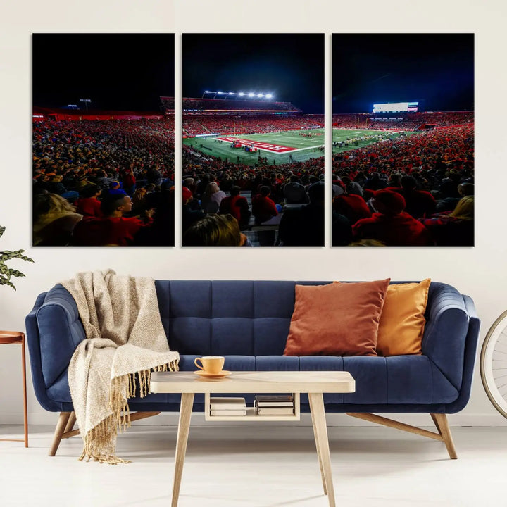 The living room is adorned with a stunning Rutgers Scarlet Knights Football Team Print – SHI Stadium, Piscataway Wall Art Canvas Print. This vibrant stadium scene at night, with its bright lights, offers a gallery-quality finish and adds an elegant touch to the space.