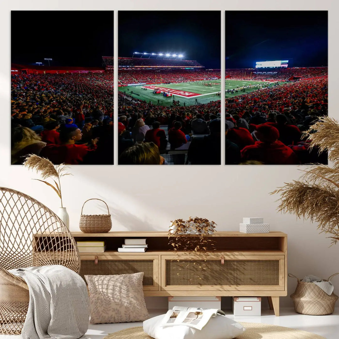 The living room is adorned with a stunning Rutgers Scarlet Knights Football Team Print – SHI Stadium, Piscataway Wall Art Canvas Print. This vibrant stadium scene at night, with its bright lights, offers a gallery-quality finish and adds an elegant touch to the space.