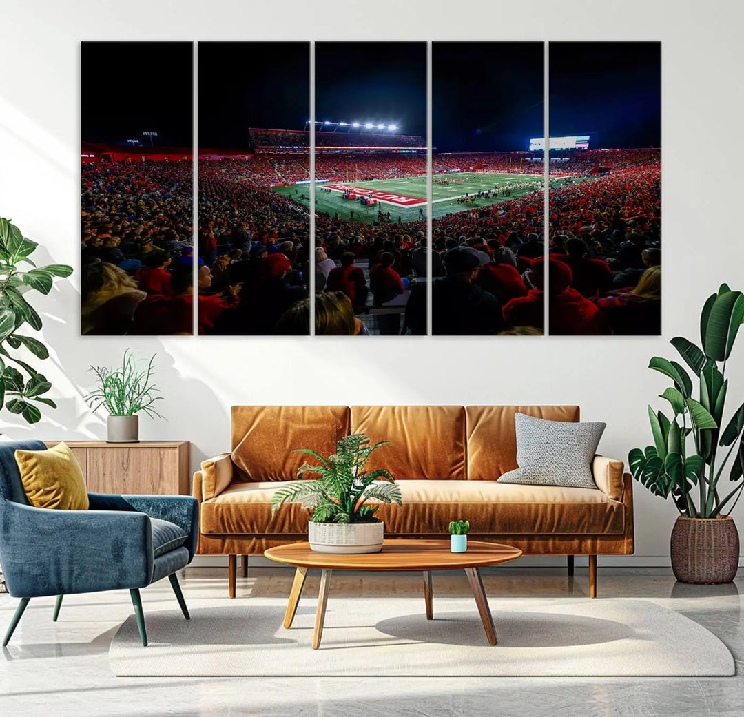 The living room is adorned with a stunning Rutgers Scarlet Knights Football Team Print – SHI Stadium, Piscataway Wall Art Canvas Print. This vibrant stadium scene at night, with its bright lights, offers a gallery-quality finish and adds an elegant touch to the space.