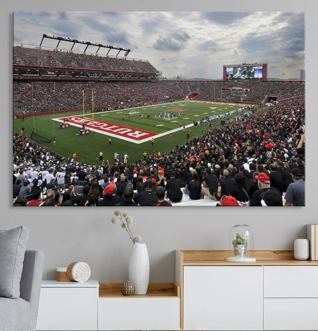 The elegant dining area features a large Rutgers Scarlet Knights Football Team print of SHI Stadium, Piscataway on the wall, boasting a gallery-quality finish.