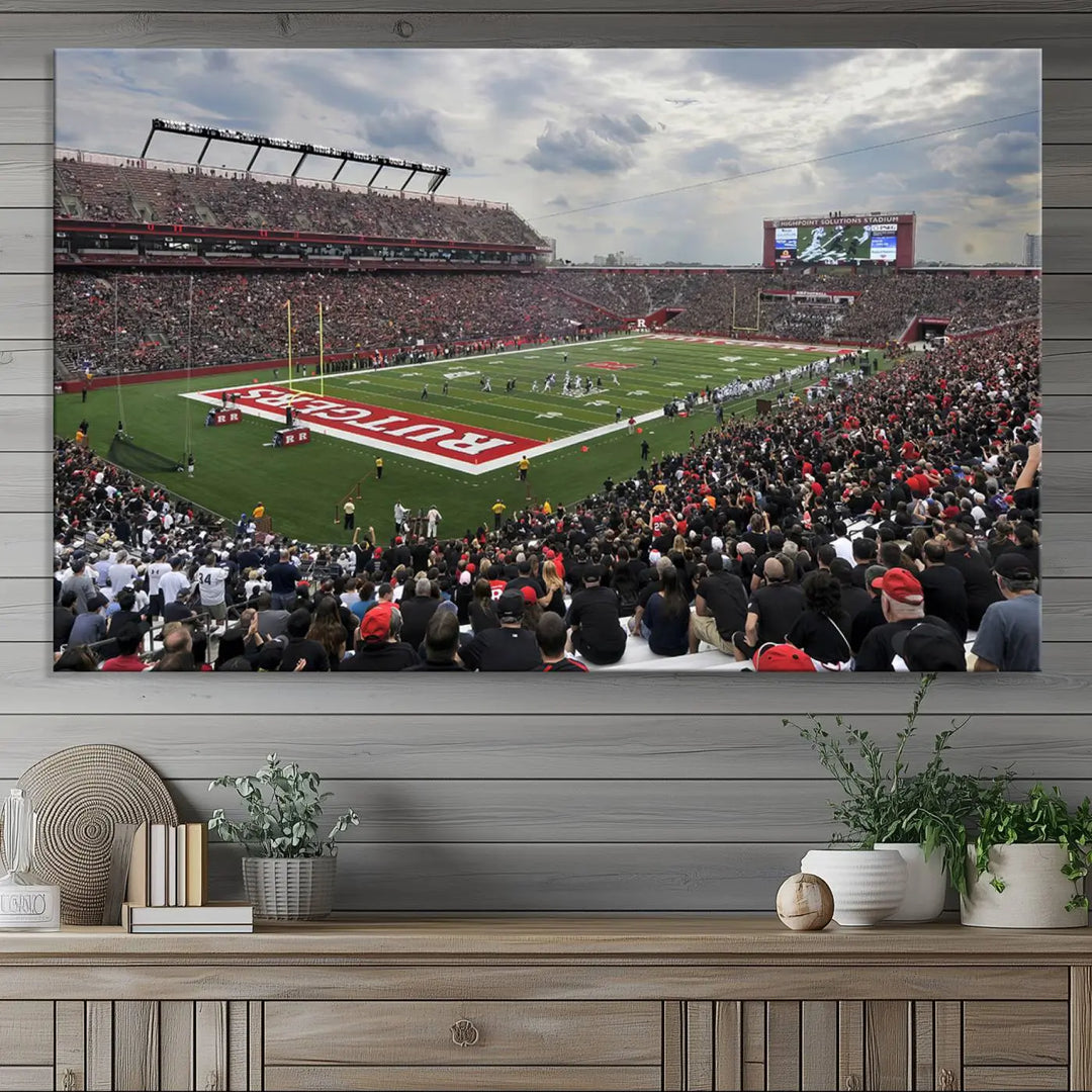 The elegant dining area features a large Rutgers Scarlet Knights Football Team print of SHI Stadium, Piscataway on the wall, boasting a gallery-quality finish.