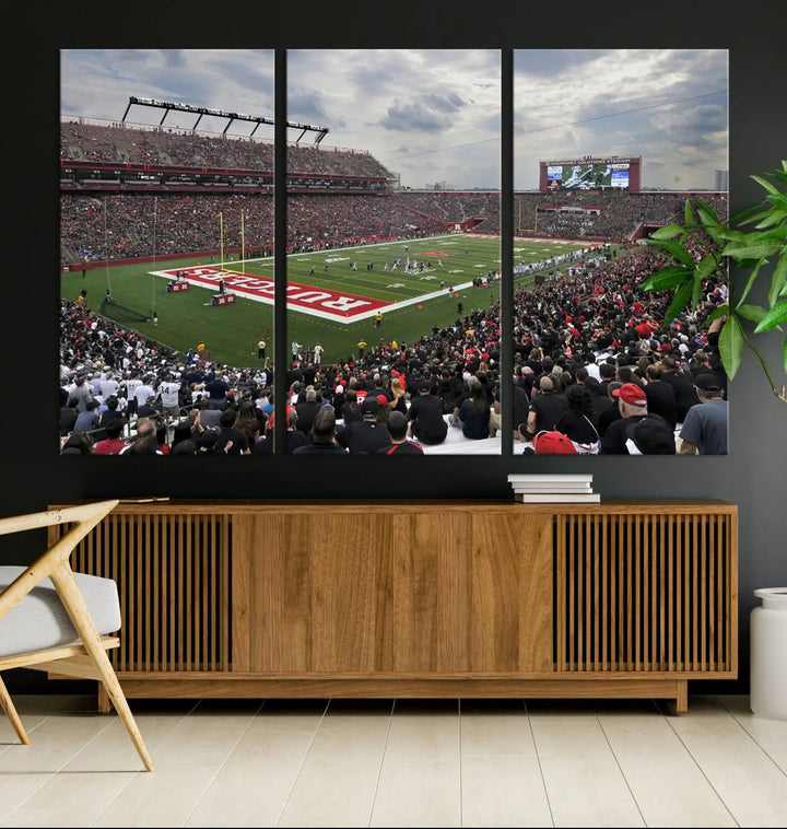 The elegant dining area features a large Rutgers Scarlet Knights Football Team print of SHI Stadium, Piscataway on the wall, boasting a gallery-quality finish.