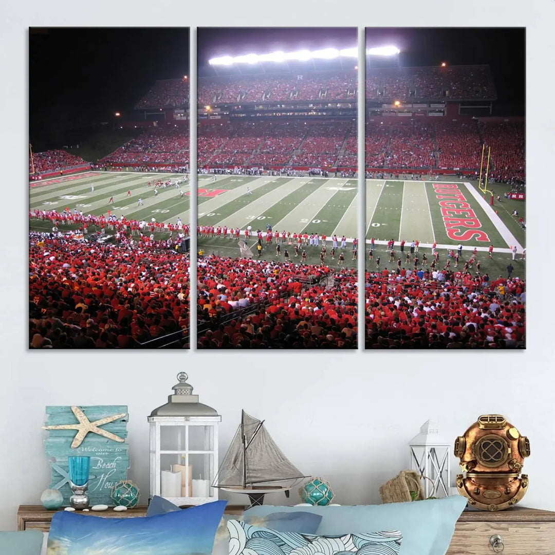 The Rutgers University Scarlet Knights Football Team Print - Piscataway SHI Stadium Wall Art Canvas Print adds an elegant touch to a stylish room. Handmade in the USA, it captures the spirited ambiance of a packed football stadium at night perfectly.