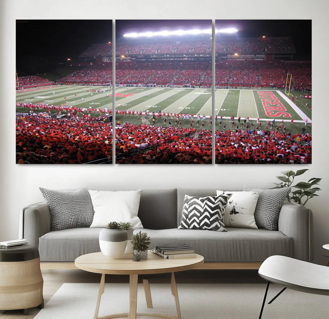 The Rutgers University Scarlet Knights Football Team Print - Piscataway SHI Stadium Wall Art Canvas Print adds an elegant touch to a stylish room. Handmade in the USA, it captures the spirited ambiance of a packed football stadium at night perfectly.